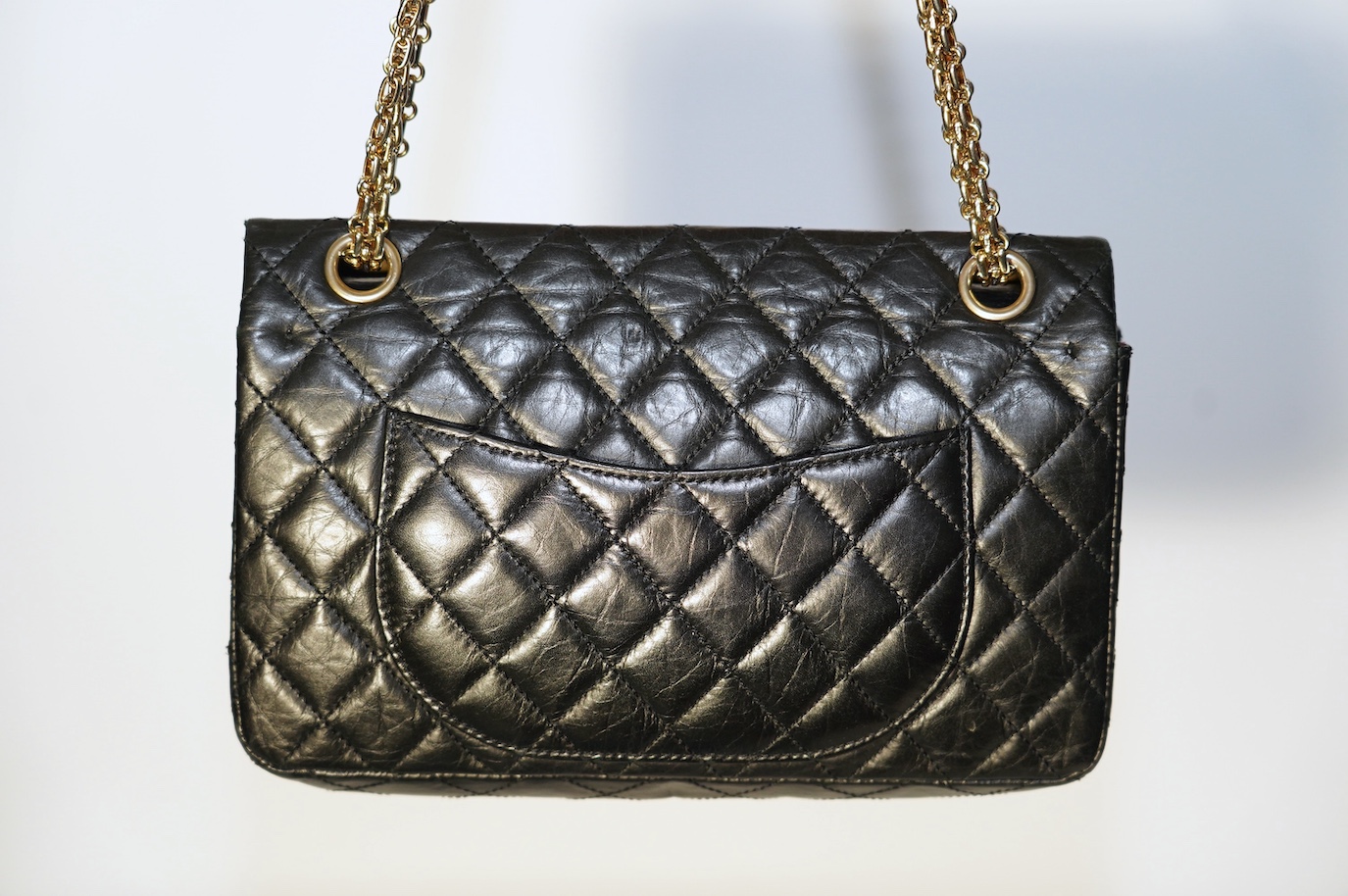 A Chanel 2.55 black leather handbag